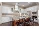 Modern kitchen featuring stainless steel appliances, granite countertops, and ample cabinet space at 3234 N 163Rd Dr, Goodyear, AZ 85395