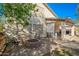 Backyard featuring a stone firepit, a covered patio with furniture, and string lights at 3299 E Boston St, Gilbert, AZ 85295