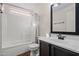 Bright bathroom featuring a tub/shower combination, vanity, and sink at 3299 E Boston St, Gilbert, AZ 85295