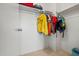 Walk-in closet featuring clothes hanging on a rod, a shelf above, and carpeted floors at 3299 E Boston St, Gilbert, AZ 85295