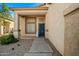 Inviting front entrance with stone walkway, desert landscaping and covered porch, enhancing curb appeal at 3299 E Boston St, Gilbert, AZ 85295