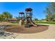 Community playground with slides, climbing features and a soft ground cover at 3299 E Boston St, Gilbert, AZ 85295