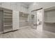 Spacious walk-in closet with custom shelving and storage solutions, plus access to the en suite bathroom at 3373 E Oriole Way, Chandler, AZ 85286