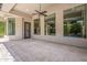 Spacious covered patio with a ceiling fan and views of the backyard oasis at 3373 E Oriole Way, Chandler, AZ 85286