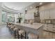 This bright kitchen offers a large island, stainless appliances, and a breakfast nook with bay windows at 3373 E Oriole Way, Chandler, AZ 85286