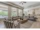 Spacious living room with abundant natural light and seamless flow into the open-concept kitchen and dining area at 3373 E Oriole Way, Chandler, AZ 85286