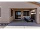 Cozy covered back patio with lounge seating, a rug, and a sliding glass door to the house at 34969 N Open Range Dr, San Tan Valley, AZ 85144