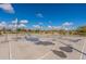 Community basketball court features basketball hoops and painted lines, ideal for an active and fun neighborhood at 34969 N Open Range Dr, San Tan Valley, AZ 85144