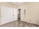 Bedroom featuring sliding closet doors and stylish flooring, offering ample storage and modern appeal at 34969 N Open Range Dr, San Tan Valley, AZ 85144