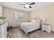 Cozy bedroom featuring a decorative bed frame and matching nightstands and dresser at 34969 N Open Range Dr, San Tan Valley, AZ 85144