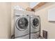 Laundry room featuring modern washer and dryer, offering convenience and functionality at 34969 N Open Range Dr, San Tan Valley, AZ 85144