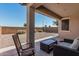 Covered patio with outdoor seating, creating a relaxing space for enjoying the fresh air at 34969 N Open Range Dr, San Tan Valley, AZ 85144