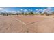 Community volleyball court features a well-maintained sand pit and net, perfect for some fun under the sun at 34969 N Open Range Dr, San Tan Valley, AZ 85144