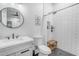 Stylish bathroom with black and white tile, modern vanity, and rain shower head at 35150 N Bell Rd, Queen Creek, AZ 85144