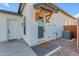 Inviting front entrance with wooden accents and a textured welcome mat creates curb appeal at 35150 N Bell Rd, Queen Creek, AZ 85144