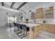 Well-lit kitchen featuring a large island, modern appliances, and open shelving at 35150 N Bell Rd, Queen Creek, AZ 85144