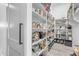 Walk-in pantry with ample shelving for organized storage of food and appliances at 35150 N Bell Rd, Queen Creek, AZ 85144