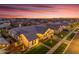 Stunning aerial view of a modern home in a Primary-planned community with beautiful sunset skies at 3547 E Bloomfield Pkwy, Gilbert, AZ 85296