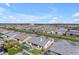 Expansive aerial shot showcases a neighborhood with a community pool, green spaces and mountain views at 3547 E Bloomfield Pkwy, Gilbert, AZ 85296