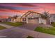 Charming single-story home featuring a brick-paved driveway, well-manicured lawn, and a two-car garage at 3547 E Bloomfield Pkwy, Gilbert, AZ 85296