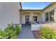 Welcoming front porch with decorative columns, gray-brick walkway and seating area for relaxing at 3547 E Bloomfield Pkwy, Gilbert, AZ 85296