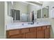 Bathroom features dual sinks, a large mirror, and neutral colors at 3663 E Camden Ave, San Tan Valley, AZ 85140