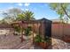 Outdoor garden area with raised garden beds and protective coverings at 3663 E Camden Ave, San Tan Valley, AZ 85140