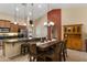 Kitchen and dining area featuring stainless appliances, a large island, and tile floors at 3663 E Camden Ave, San Tan Valley, AZ 85140