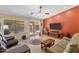 Cozy living room with tile flooring, ceiling fan, and a sliding glass door at 3663 E Camden Ave, San Tan Valley, AZ 85140