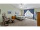 Tranquil bedroom with vaulted ceilings, cozy carpet, and lots of natural light at 3663 E Camden Ave, San Tan Valley, AZ 85140