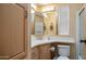 Cozy bathroom featuring a vanity with sink, medicine cabinet, and a toilet; ideal for comfort and functionality at 39 Iron Ore Dr, Apache Junction, AZ 85119