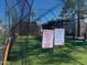 Fully netted batting cage with visible safety guidelines for baseball and softball practice at 39 Iron Ore Dr, Apache Junction, AZ 85119