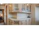 Bright kitchen area featuring ample counter space, wood cabinets and decorative tile accents at 39 Iron Ore Dr, Apache Junction, AZ 85119