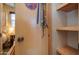 Storage with wood shelves and a door leading into a bedroom at 39 Iron Ore Dr, Apache Junction, AZ 85119