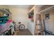 Utility room with washer, dryer, and storage shelves, providing practical space for laundry and organization at 39 Iron Ore Dr, Apache Junction, AZ 85119