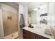 Modern bathroom featuring a stand-up shower with stone tile and a vanity with marble countertops at 4745 N Scottsdale Rd # 3008, Scottsdale, AZ 85251