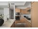 Modern kitchen featuring stainless steel appliances, light wood cabinetry and island seating at 4745 N Scottsdale Rd # 3008, Scottsdale, AZ 85251