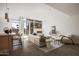 Bright living room featuring fireplace, floor-to-ceiling windows, and neutral color palette at 4745 N Scottsdale Rd # 3008, Scottsdale, AZ 85251