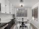 Bright breakfast nook with modern white cabinets and a charming round table with seating at 500 N Roosevelt Ave # 102, Chandler, AZ 85226