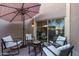 Private patio with comfortable seating and access to the living room through sliding glass door at 500 N Roosevelt Ave # 102, Chandler, AZ 85226