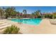 Community pool and sundeck with ample lounge chairs and shaded pergola, a great place to unwind at 500 N Roosevelt Ave # 102, Chandler, AZ 85226