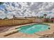 Spacious backyard features a swimming pool and mature trees at 5125 W Las Palmaritas Dr, Glendale, AZ 85302