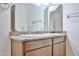 A full bathroom with double vanity sinks and granite countertops for enhanced appeal at 5125 W Las Palmaritas Dr, Glendale, AZ 85302