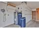 Functional garage space with storage shelves and water heater at 5125 W Las Palmaritas Dr, Glendale, AZ 85302