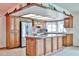 Well-appointed kitchen featuring a center island, stainless steel appliances, and ample cabinet space at 5125 W Las Palmaritas Dr, Glendale, AZ 85302