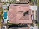 Aerial view of tile roof, outdoor kitchen, pool and backyard at 5142 N 205Th Gln, Buckeye, AZ 85396