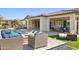 Spacious backyard featuring a pool, outdoor seating, patio, and lush landscaping perfect for entertaining at 5142 N 205Th Gln, Buckeye, AZ 85396