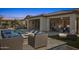 Resort-style backyard featuring a pool, patio seating, and fire pit perfect for entertaining at 5142 N 205Th Gln, Buckeye, AZ 85396