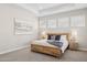 Serene bedroom with tray ceiling, natural light and neutral decor at 5142 N 205Th Gln, Buckeye, AZ 85396