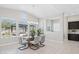 Bright dining area with large windows, stylish lighting, and seating for six at 5142 N 205Th Gln, Buckeye, AZ 85396